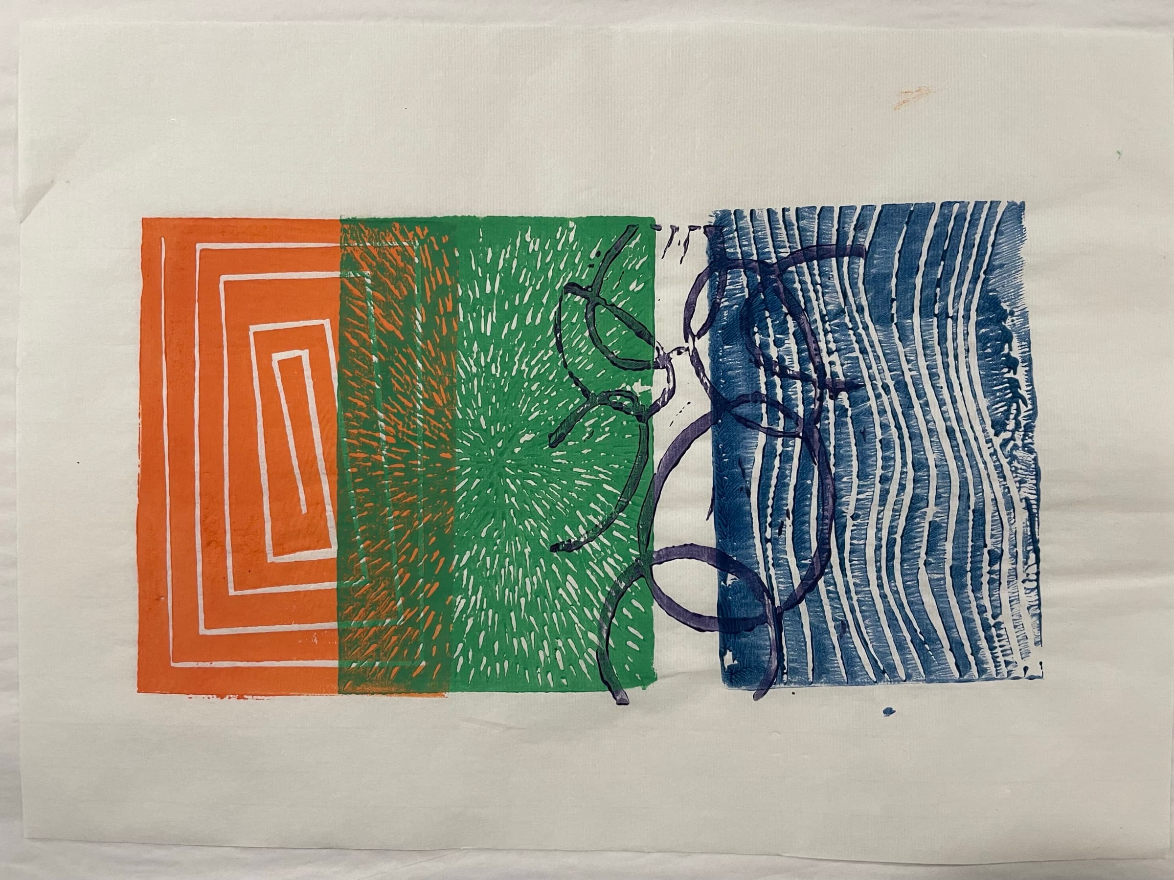 A horizontal three-block print: an orange concentric-square block on the left bleeding into a green radial-burst block in the center, with a deep navy organic loop block on the right.