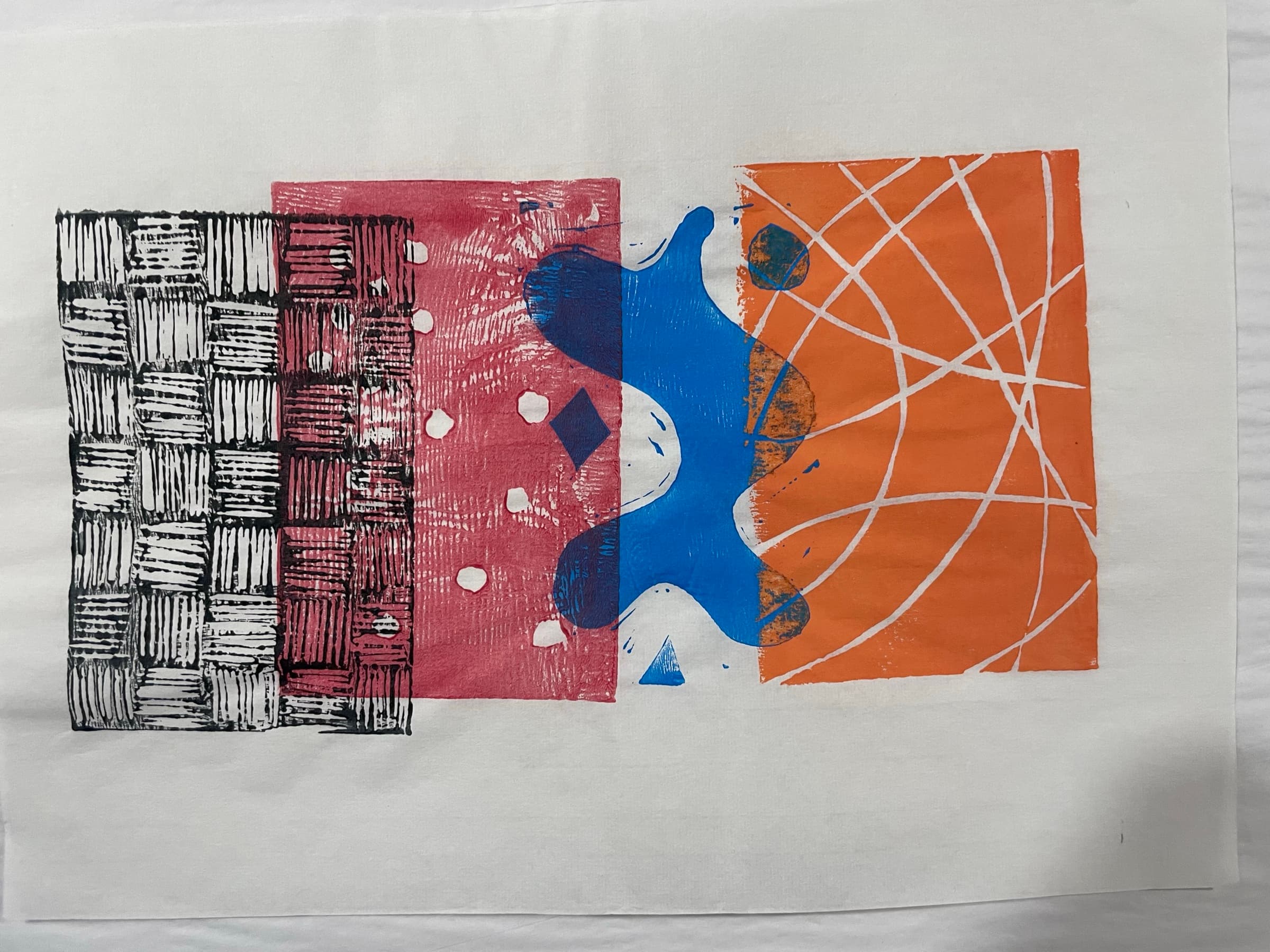 A horizontal three-block print with denser ink coverage and tighter registration.