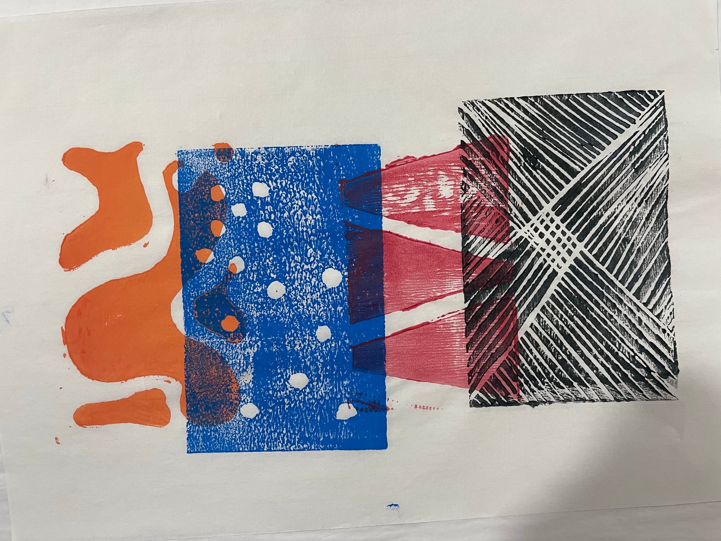 A horizontal four-block print: an orange organic shape block, a blue dot-field block with a wine-red triangle peeking through, and a black geometric crosshatch block.