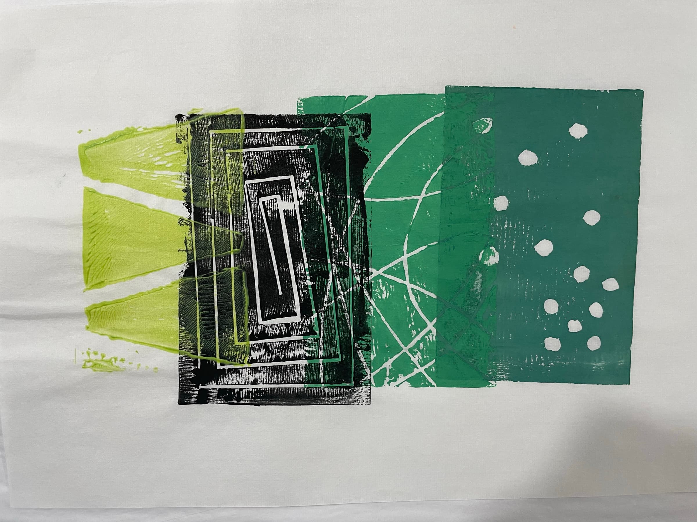 A four-block print: a chartreuse splash on the left, a black-and-white concentric-rectangle block, an emerald-green organic shapes block, and a teal dot-field block on the right.