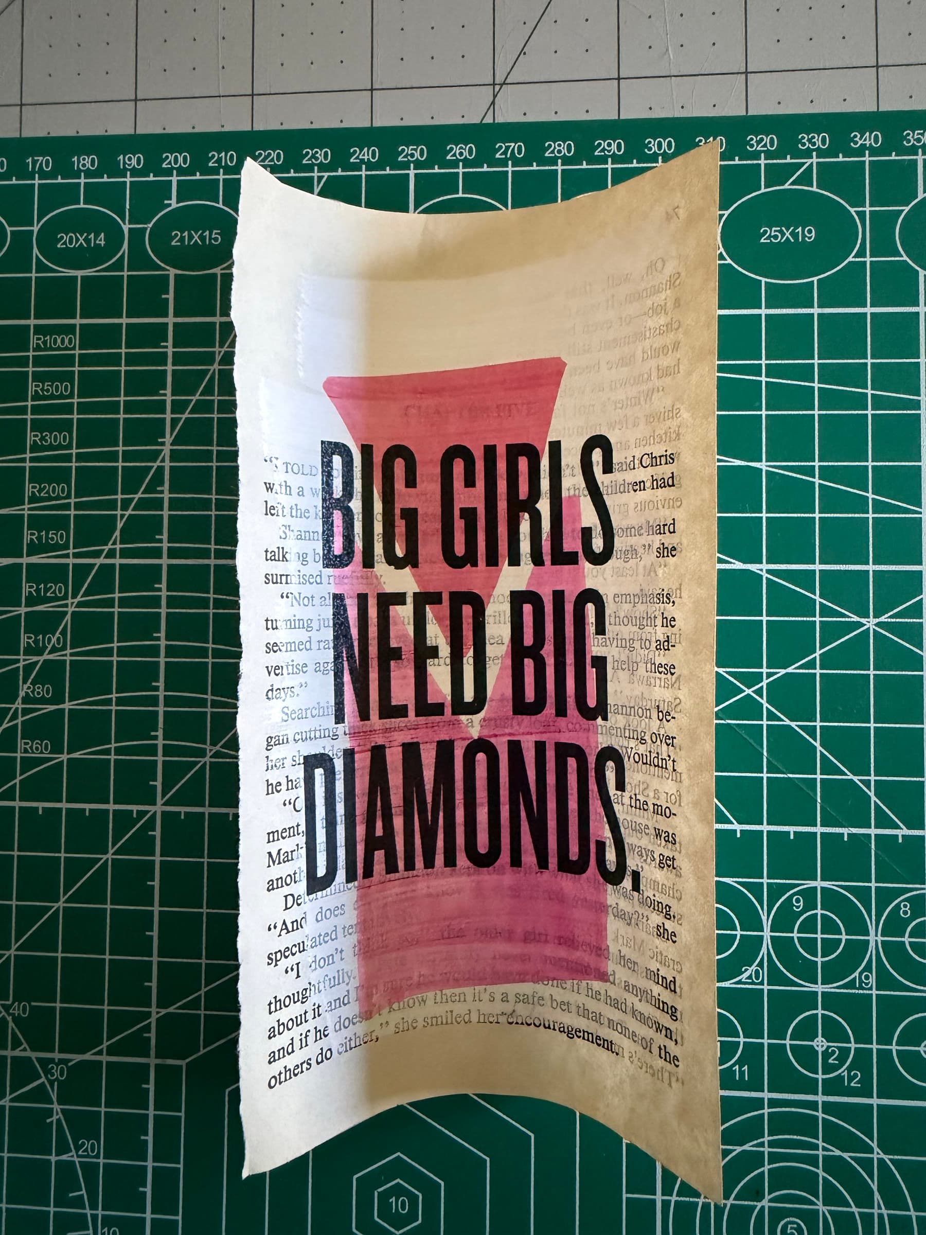 BIG GIRLS NEED BIG DIAMONDS: black display caps overprinted on a hot-pink watercolor block arcing diagonally across the page