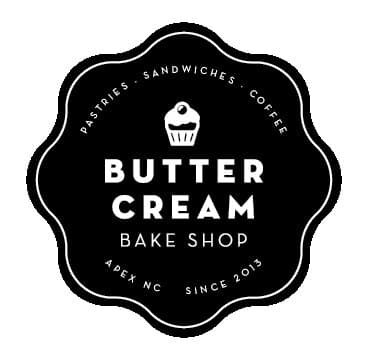 The Buttercream Bake Shop primary badge: black scalloped roundel with a small cupcake illustration centered at the top, BUTTER / CREAM stacked in white caps, BAKE SHOP underneath, and PASTRIES · SANDWICHES · COFFEE running around the top inside the scallop with APEX NC · SINCE 2013 around the bottom.