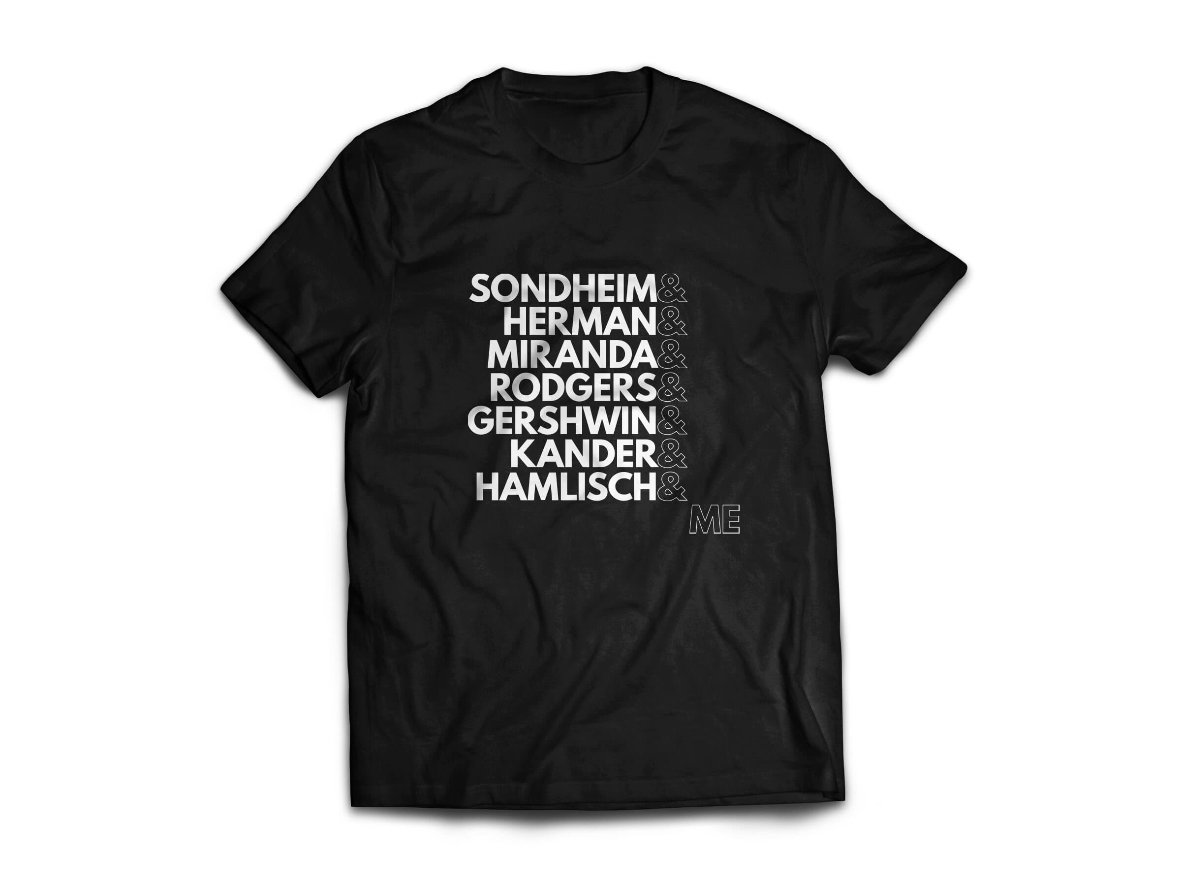 A black t-shirt printed with seven composer surnames stacked in white display caps separated by ampersands (SONDHEIM & HERMAN & MIRANDA & RODGERS & GERSHWIN & KANDER & HAMLISCH &) and ending with ME set in outline caps so the wearer becomes the next name in the line.