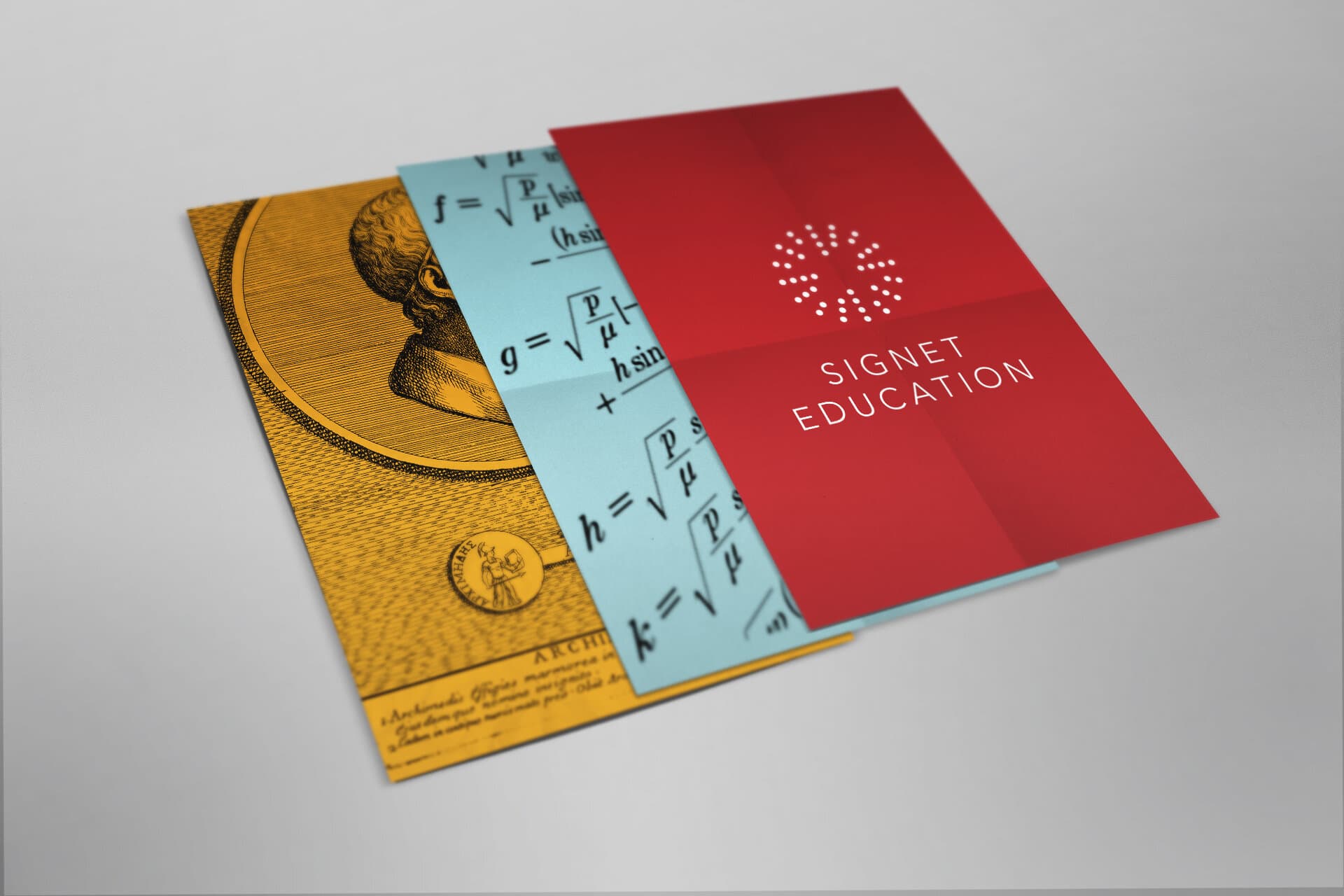 Three printed pieces overlapped on a white surface: a yellow engraving of an antique bust, a pale-blue page of mathematical formulae, and a red Signet Education cover with the dotted mark and the word SIGNET set in the brand sans-serif.